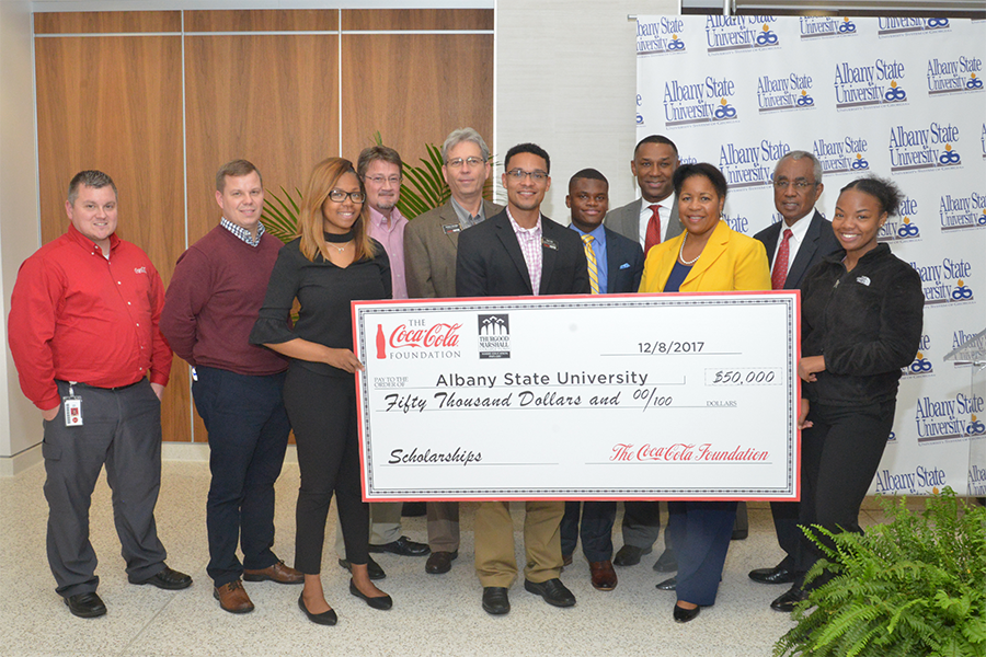 TMCF President & CEO, Johnny C. Taylor, Jr., and CoCa Cola representatives present ASU President Art Dunning with $50,000 to support scholarships for first-generation college students at ASU.