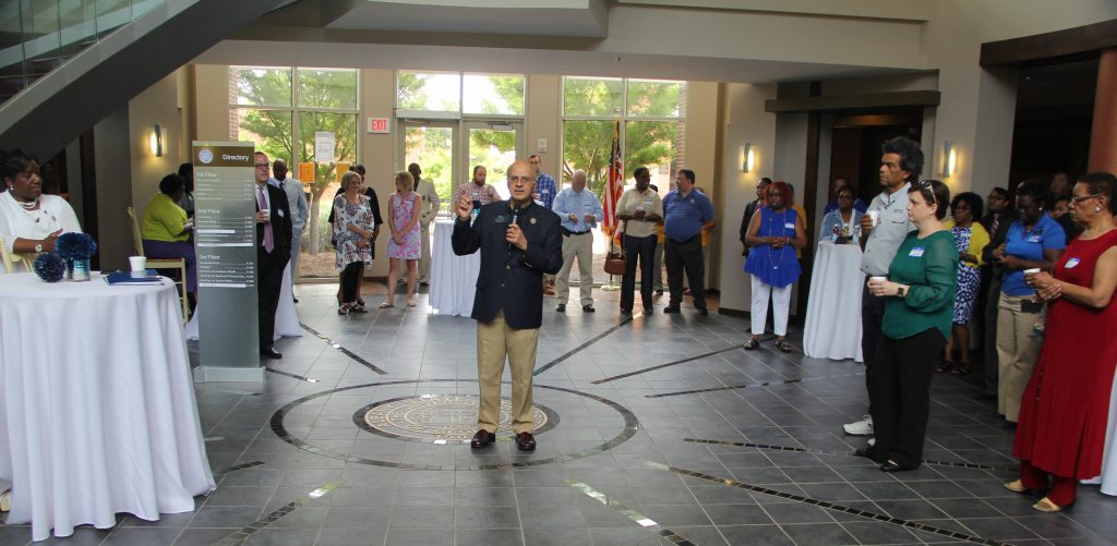 Raj Parikh, the new interim provost and vice president for Academic Affairs, speaks to faculty and staff members at June's Coffee with the Cabinet.