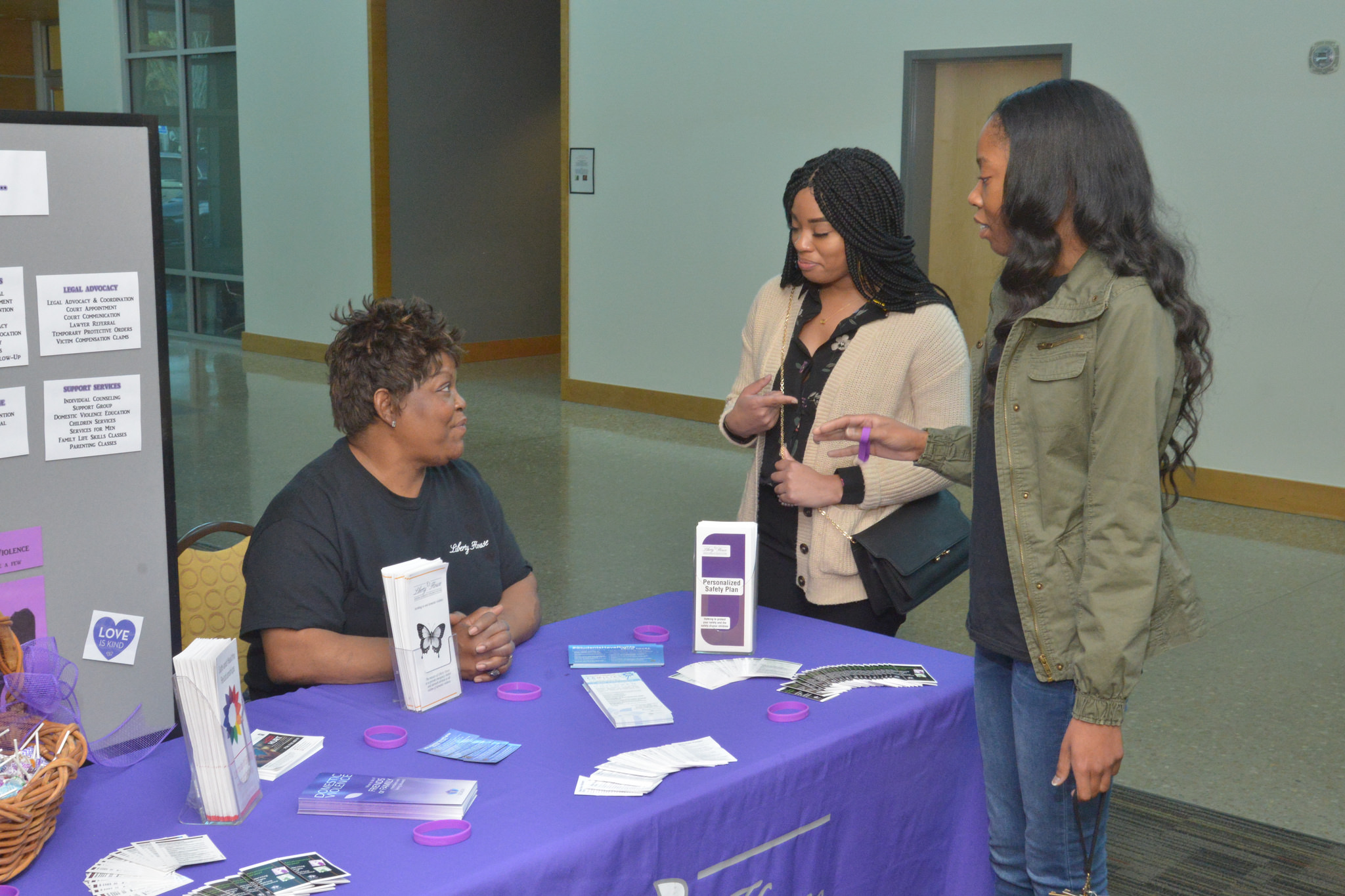 Debra Davis, Liberty House shelter advocate, Courtney Jenkins, Liberty House intern, and T'Aandre Sears, outreach advocate, provided resources to students at the Dating Violence Maze activity.