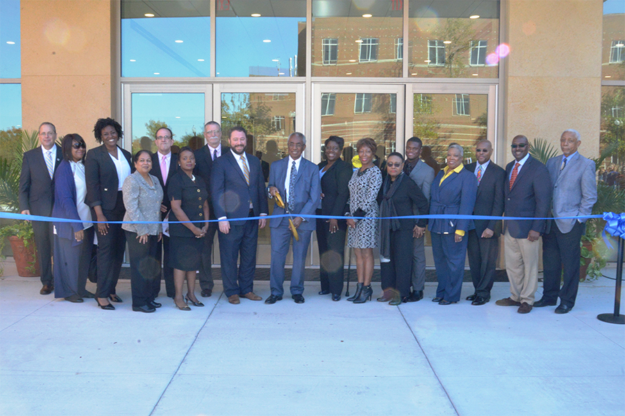 Public officials, and ASU administrators, faculty, staff, and students cut the ribbon at the ribbon cutting ceremony for the ASU Fine Arts Center